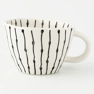 Hand-painted ceramic mug with a black and white geometric linear pattern and an irregular shape, Arkaim Home 