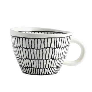 Hand-painted ceramic mug with a black and white geometric pattern and an irregular shape, Arkaim Home 