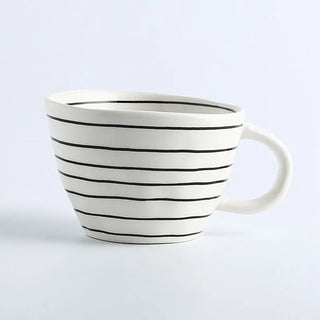 Hand-painted ceramic mug with a black and white striped pattern and an irregular shape, Arkaim Home 