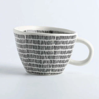 hand-painted ceramic mug with a black and white geometric pattern and an irregular shape, Arkaim Home