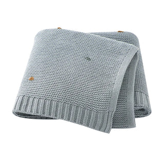 Bibi Cotton Knit Baby Blanket in soft pastel blue, folded neatly.