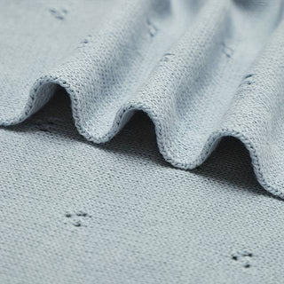 Gigi cotton knit baby blanket in soft pastel blue.