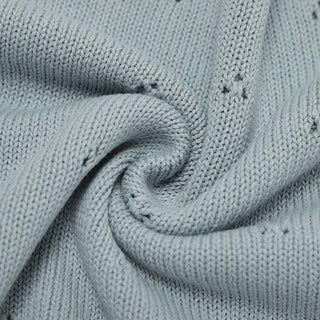 Gigi cotton knit baby blanket in soft pastel blue.