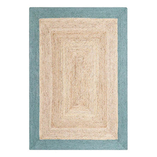 Handmade natural jute rug with a blue border, crafted in India—adds texture and timeless style to Scandi, coastal, or boho-inspired interiors.