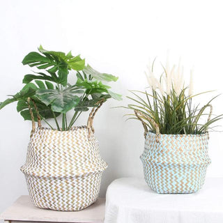 Handwoven natural and white seagrass storage basket with handles, perfect as a stylish hanging basket, pot planter, or decorative storage solution. This eco-friendly, two-tone basket adds a touch of natural boho touch while keeping your space organized. Shop handcrafted storage baskets at our natural homeware store.