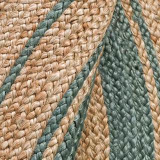 Round handwoven jute rug with concentric two-tone braided design in natural and neutral shades—ideal for boho, coastal, or modern home décor.