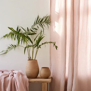 Blush pink linen rod pocket curtain hanging in a sunlit room — natural window treatment with soft drape and textured finish. 