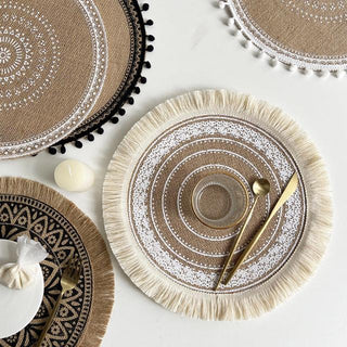 Set of four hessian boho placemats featuring a natural fibre weave and mandala design, perfect for rustic or coastal table settings.
