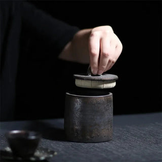 Bronze Japanese stoneware storage jar with lid, featuring a rustic finish. Perfect for kitchen organization, this ceramic canister provides airtight storage for tea, coffee, spices, or pantry essentials. A stylish and functional addition to natural homeware and minimalist décor.
