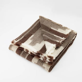 Thick wool blanket in a brown and beige geometric pattern - artisan blanket for Scandi interiors.