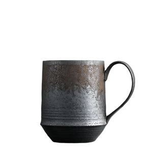 Handmade stoneware mug with a bronze metallic glaze, inspired by wabi-sabi aesthetics.