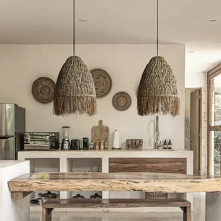 Handwoven raffia straw pendant light with open-weave coastal design and organic texture for warm, ambient lighting.