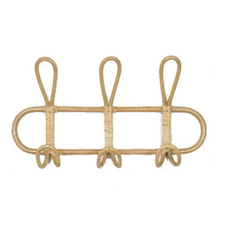 Cai handmade rattan wall hooks featuring looped boho design with 3 hooks, ideal for organising a child’s room or nursery.