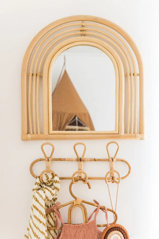 Cai handmade rattan wall hooks featuring looped boho design with 3 hooks, ideal for organising a child’s room or nursery.