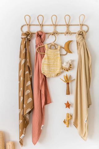 Cai handmade rattan wall hooks featuring looped boho design with 5 hooks, ideal for organising a child’s room or nursery.