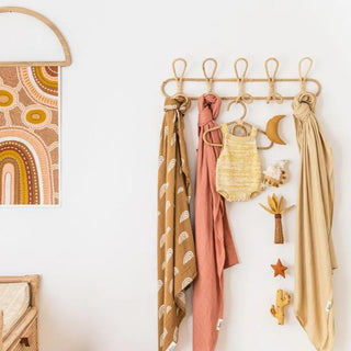 Cai handmade rattan wall hooks featuring looped boho design with 5 hooks, ideal for organising a child’s room or nursery.