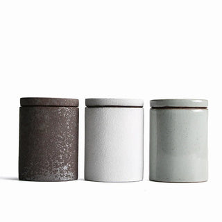 Minimalist ceramic canister for tea, coffee and dry food storage.