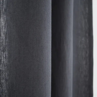 Charcoal grey linen curtain—natural window treatment with soft drape and textured finish. 