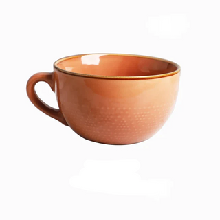 Large hand-painted ceramic coral mug with dotted pattern, glossy finish, and vibrant colour, ideal for hot drinks, soup, or cereal.