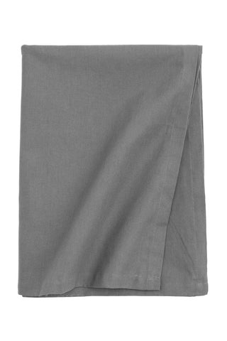 Dark grey cotton tablecloth with soft texture and elegant drape for modern, minimalist dining setting.