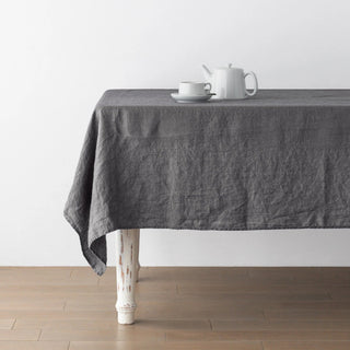 Charcoal grey table linen with textured drape.