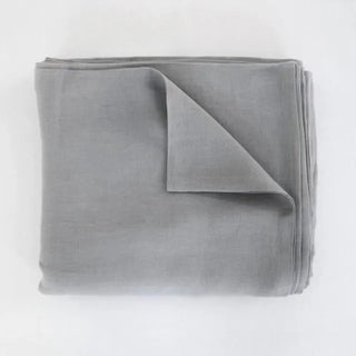Dark grey pure linen flat sheet and 2 pillowcases set. Available in a range of neutral colours and sizes from Arkaim Home. Natural linen is breathable, textured, and perfect for relaxed year-round comfort. Great for modern, Boho, Scandi, wabi-sabi bedroom interiors.