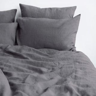 Close up of dark grey linen pillows and duvet cover. Perfect for modern, minimalist, scandi or boho bedrooms.