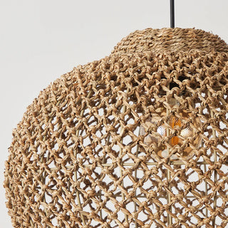 Handwoven seagrass pendant light with an open, rounded bell shape, showcasing natural texture and woven detailing. Perfect for hallways, bedrooms, dining and living rooms.