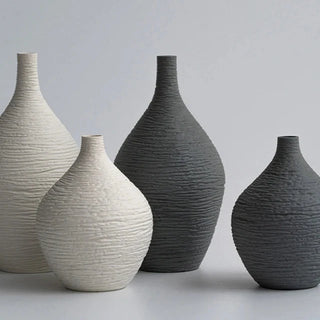 Modern ceramic flower black and white vases from the Emi Vases collection, featuring a sleek, minimalistic design with ribbed texture. Crafted from high-quality ceramic, these vases enhance contemporary, minimal or scandi home décor with their sculptural elegance. Perfect for displaying as a standalone piece or grouped together on a shelf or console, they add sophistication and refinement to any room.