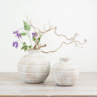 Sculptural ceramic vases with etched linear motif for modern and coastal interiors.