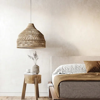 Evi handwoven rattan pendant light with natural weave and soft ambient glow, perfect for modern or coastal interiors.