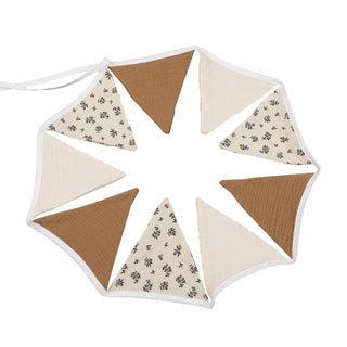 Handcrafted cotton flag bunting banner in warm neutrals as nursery or party decoration.
