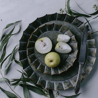 Handmade fluted iron serving plate with rustic galvanised finish, perfect for food presentation or decorative use.