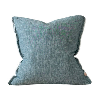 Dark teal linen cushion with frayed edges and soft textured finish.