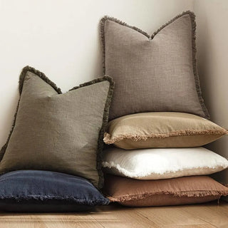 Textured cotton cushions in various colours for modern, layered styling.