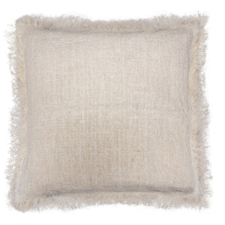 A square throw pillow in a textured white linen fabric with a fringed border.