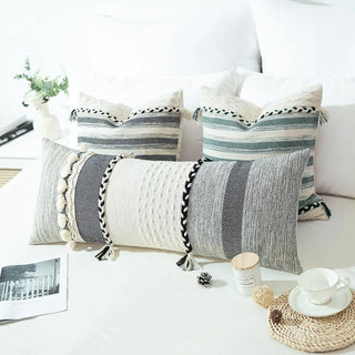 Handmade cotton cushion cover with green striped accents and fringed tassels—textured and breathable, perfect for boho or ethnic-inspired home décor.