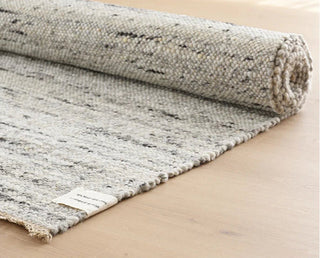 Anvi handmade wool and linen rugs in light grey, earthy tones, featuring a bubbly textured surface - ideal for Scandi, minimalist, or modern interiors.