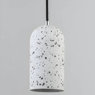 Grey terrazzo pendant light with smooth curved shape against neutral background.