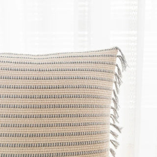 Handwoven Nura Cotton Cushion Cover with embroidered grey stripes and fringe tassels. Made from a breathable cotton-linen blend for a soft, cozy, and stylish home décor touch. Perfect for modern and boho interiors. Shop sustainable cushion covers online.