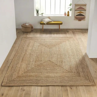 Braided natural jute rug with earthy texture Arkaim Home