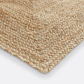 Handmade natural jute rug with braided weave by Arkaim Home