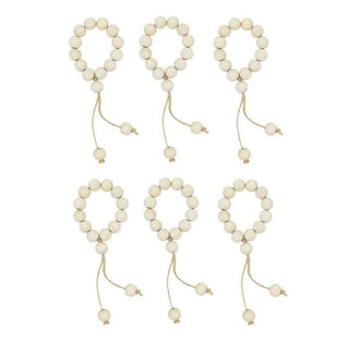 Set of six handmade wood bead napkin rings with whitewashed wood and hemp rope, perfect for natural and eco-styled table settings.
