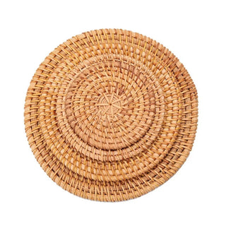 Natural round handwoven rattan placemats and coasters, eco-friendly and heat-resistant for stylish table protection.
