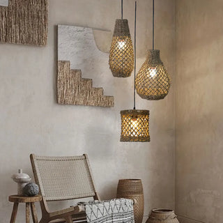 Natural seagrass pendant lights grouped together in a cluster to create a focal point in a minimalist interior.