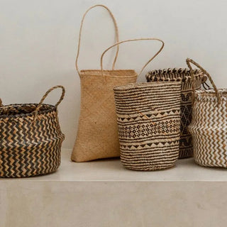 Natural handwoven seagrass storage baskets in multiple sizes, ideal for minimalist and boho storage or decorative use.