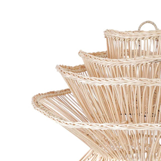 Natural handwoven rattan pendant light with organic, wave-like shape and soft ambient glow, ideal for boho and modern interiors.