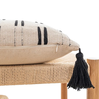 Ayat Linen Blend Cushion Cover – decorative black and white boho cushion with tasselled corners. Made from a soft linen-cotton blend, featuring an ethnic-inspired pattern for a natural home décor touch.