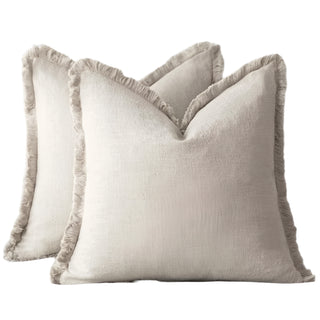 Ivory fringed cotton cushion covers, made from 100% natural cotton for a soft and breathable feel. Featuring elegant ruffled edges, these timeless cushion covers are available in two sizes for flexible styling in any home décor.