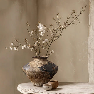 Wabi sabi decorative pottery vase for dried branches.